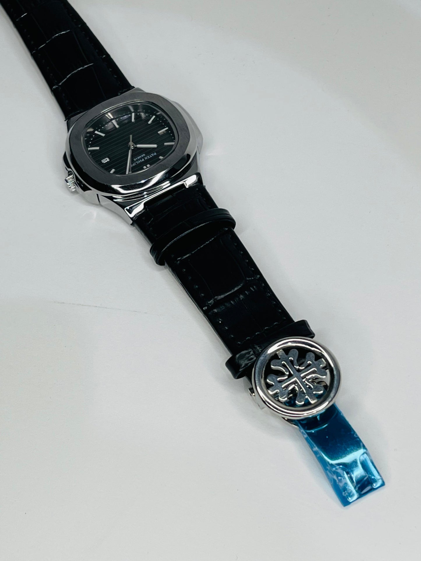 "Patek Philippe black dial with black leather strap watch"