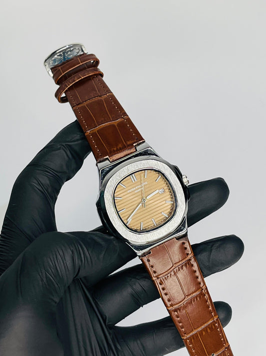 "Patek Philippe walnet dial with brown leather strap watch"